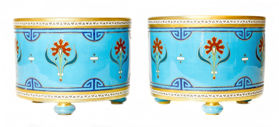 PAIR MINTON PORCELAIN JARDINIERS (1862-1871): PAIR MINTON PORCELAIN JARDINIERS Impressed Minton Mark for 1862-1871. Each of drum form, decorated with enamels in Chinese/Japanese cloisonne style. Height 9 1/4, Diameter 8 inches.