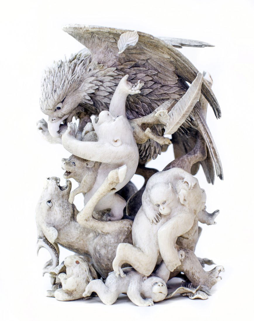JAPANESE CARVED IVORY GROUP (MEIJI PERIOD): VERY FINE JAPANESE IVORY OKIMONO Meiji Period (1868-1912). Signed. Depicting a finely detailed Falcon with numerous monkeys, a rabbit, and a deer. Height 5 inches.