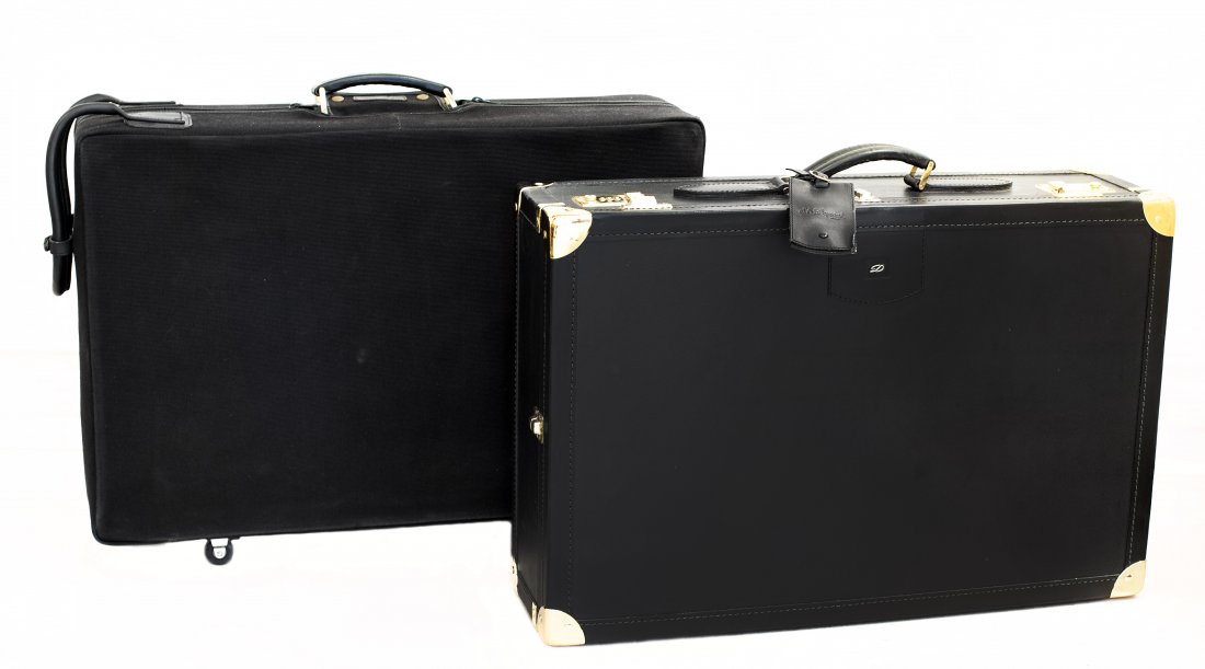 TWO S.T. DUPONT PARIS LEATHER TRAVEL TRUNKS: PROPERTY OF A PALM BEACH LADY: TWO S.T. DUPONT PARIS LEATHER TRAVEL TRUNKS Each stamped and labeled with I.D. Card, S.T. Dupont Paris. Top carrying handle, with gilt brass studded hardware, double loc