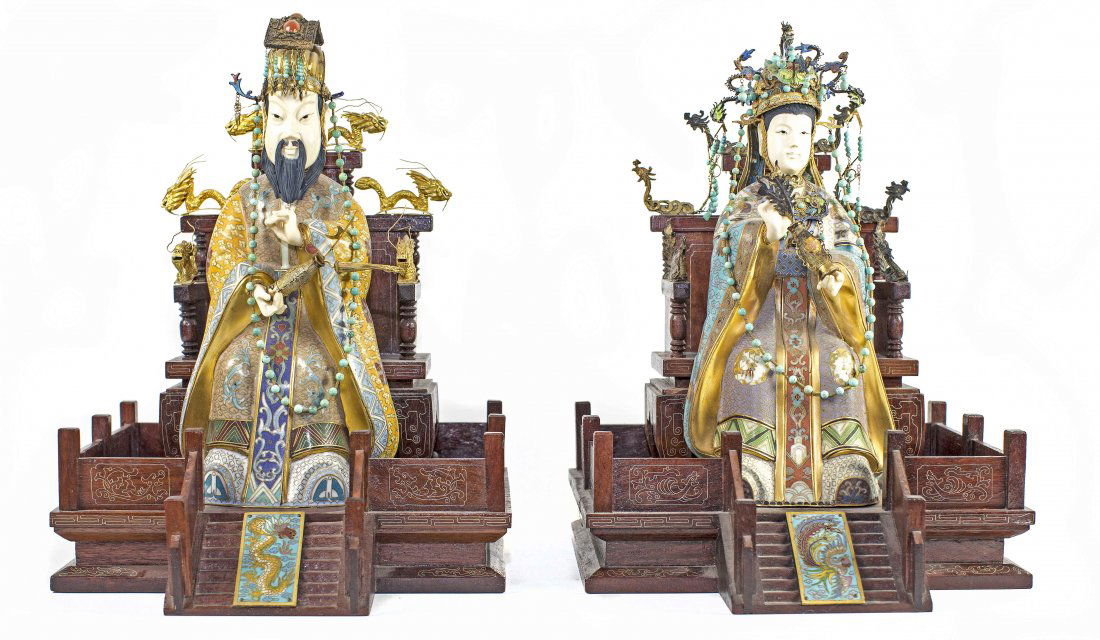 PAIR CHINESE CLOISONNÉ, CARVED IVORY FIGURES: PROPERTY OF A TEXAS ESTATE: PAIR CHINESE CLOISONNÉ, CARVED, AND POLYCHROMED IVORY EMPEROR AND EMPRESS Each depicted seated on a brass mounted, carved, silver inlaid wood throne. Height 14 1/2 inches.