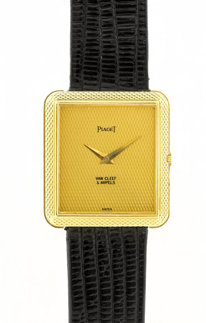 PIAGET GOLD RECTANGULAR WRISTWATCH: PROPERTY OF A PALM BEACH GENTLEMAN: PIAGET 18KT YELLOW GOLD WRISTWATCH Signed Piaget and Van Cleef & Arpels. Rectangular champagne dial, on a black lizard strap with a Piaget 18kt yellow gold buckle.
