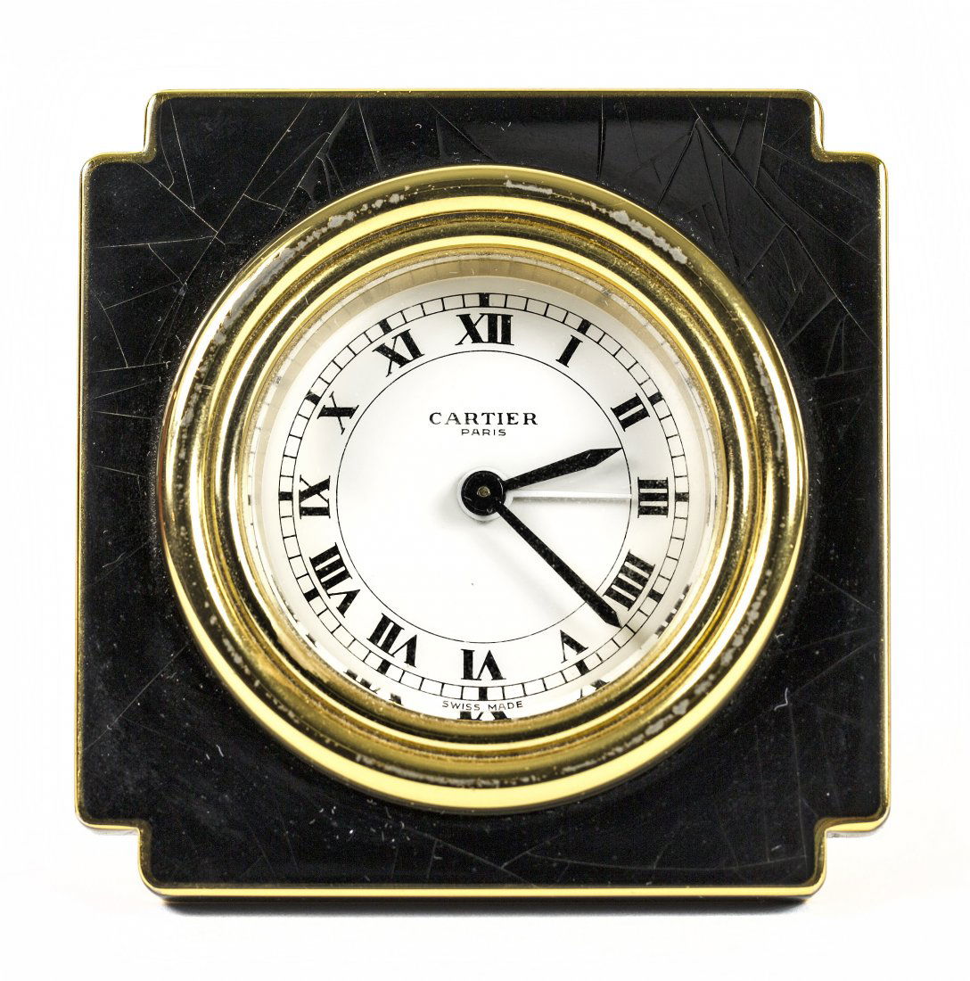 CARTIER GILTMETAL AND BLACK ENAMEL TABLE CLOCK May 05, 2013 A.B