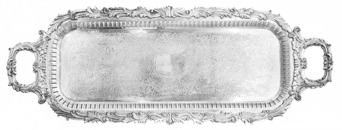 GEORGIAN STYLE SILVER PLATED SERVING TRAY: PROPERTY OF A DELRAY BEACH ESTATE: GEORGIAN STYLE SILVER PLATED SERVING TRAY Circa 1900. Of oblong form with leaf cast border flanked by conforming carrying handles and pierced sides. Length 30 inche