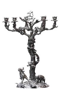 Large Romanticized Silvered Metal Six-Light Candelabra: Large Romanticized Silvered Metal Six-Light Candelabra Unmarked. Cast as a tree wrapped with vines, the base cast as a leafy mound with two dogs poised before their catch. Height 26 in., Diameter