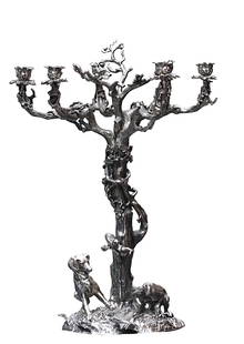 Large Romanticized Silvered Metal Six-Light Candelabra: Large Romanticized Silvered Metal Six-Light Candelabra Unmarked. Cast as a tree wrapped with vines, the base cast as a leafy mound with two dogs poised before their catch. Height 26 in., Diameter of b