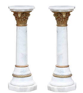 Pair of Neoclassical Style Bronze Mounted White Marble Pedestals: Pair of Neoclassical Style Bronze Mounted White Marble Pedestals Each gray veined marble columnar shaft, headed by a bronze Corinthian capital with octagonal top, the stepped base on an octagonal
