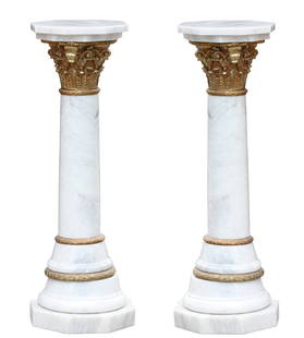 Pair of Neoclassical Style Bronze Mounted White Marble Pedestals: Pair of Neoclassical Style Bronze Mounted White Marble Pedestals Each gray veined marble columnar shaft, headed by a bronze Corinthian capital with octagonal top, the stepped base on an octagonal plin