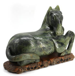 Chinese Spinach Jade Recumbent Horse: Chinese Spinach Jade Recumbent Horse The well-striated light to dark green jade with areas of pale gray and russet, on a prunus carved wood stand. Height of horse 10.25 in., Width 16 in., Depth 6.25 i