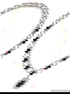 Important White Gold, Ruby and Diamond Necklace: Important White Gold, Ruby and Diamond Necklace Composed of rubies and round brilliant and single-cut diamonds. 10 Rubies weighing a total of approximately 20.00 carats, oval Ruby weighing 5.03
