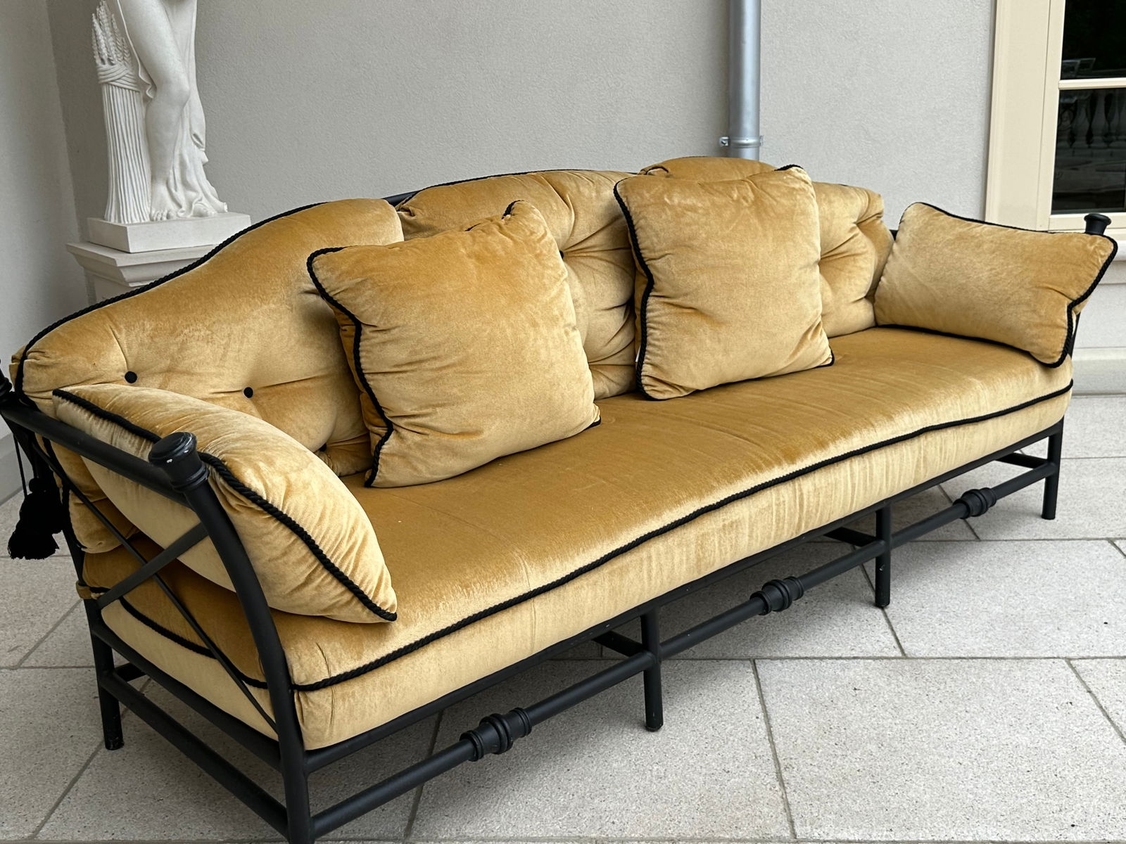 Pair of Breakwater Patinated Metal Patio Settees: Pair of Breakwater Patinated Metal Patio Settees each with gold tufted velvet upholstery. Length 96 in., Height 34 in., Depth 38 in. Provenance: Property from The Estate of a Gentleman, Gladwyne, PA.