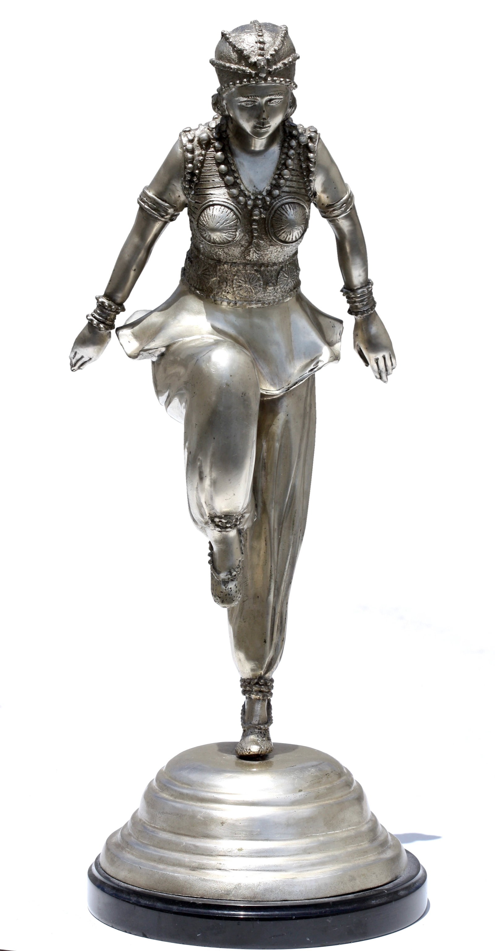 After, Claire Colinet, (1880-1950), Silvered Bronze Dancer: After, Claire Colinet, (1880-1950), Silvered Bronze Dancer 20th Century. Modelled with her arms outstretched behind her, on a black marble plinth.Height 21 in., Diameter at base 8 in. Provenance: Priv