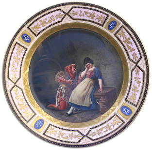 Berlin Painted and Parcel Gilt Porcelain Cabinet Plate.: Berlin Painted and Parcel Gilt Porcelain Cabinet PlateLate 19th Century. The underside with an under glazed Blue beehive, and inscribed Johannistrieb. The center recess is decorated with a young