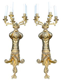 Pair of French Louis XV Style Gilt Bronze Six Light Sconces: Pair of French Louis XV Style Gilt Bronze Six Light Sconces, 19th Century. With central putti figure holding trumpets and six arm candelabras. Height 24 in. (60.96 cm.), Width 29 in. (73.66 cm.)