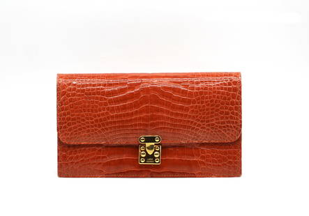 Lana Marks Orange Alligator Clutch: Lana Marks Orange Alligator Clutch Rectangular with gold-toned hardware, the flap with push-latch closure, the divided cream leather-lined interior with a zipper and a slit pocket. (wear to underside