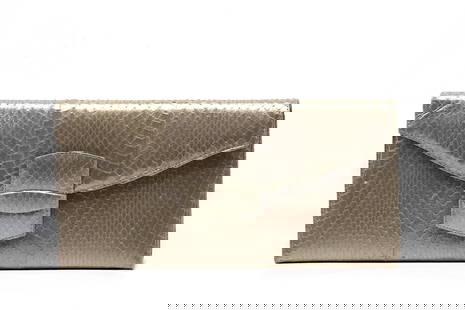 Oscar de la Renta Snakeskin Envelope Clutch: Oscar de la Renta Snakeskin Envelope Clutch The rectangular silverish gold toned clutch with magnetic snap closure, the interior with a slit pocket. Height 6.75 in., Width 6.5 in., Depth 1 in.