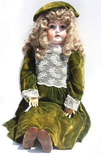 Large German Bisque Head Doll: Large German Bisque Head Doll The neck with a red stamp, circa 1900. This charming antique bisque head doll features striking blue glass sleep eyes, delicately painted lashes, feathered brows, and