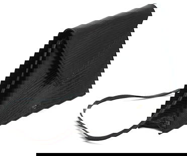 Celine Black Lizard Handbag: Celine Black Lizard Handbag The trapezoid shaped body with a triangular snap closure flap, with removeable strap, the black leather-lined interior with a slit open pocket. Height 7.5 in., Width 10 in.