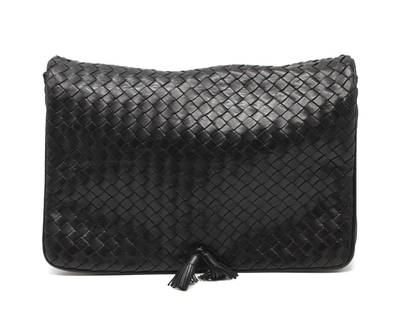 Bottega Veneta Black Leather Messenger/Document Bag: Bottega Veneta Black Leather Messenger/Document Bag The black leather woven body, with a snap closure, the flap with two tassels, with exterior zippered pocket, the front beneath the flap also with