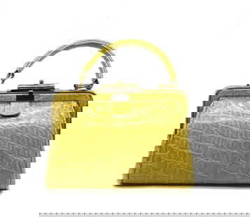 Italian Mustard Colored Alligator Handbag: Italian Mustard Colored Alligator Handbag The flared rectangular body with snap closure and gold toned metal hardware, with a short flattened handle, opening tp a cream colored leather interior, with