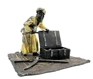 Franz Bergman, (Austrian, 1861-1936) Austrian Cold Painted Bronze: Franz Bergman, (Austrian, 1861-1936) Austrian Cold Painted Bronze Impressed with Bergman monogram. Depicting an Arab Knife Merchant, with open trunk, standing upon a rug. Height 4 in., Width 5.25