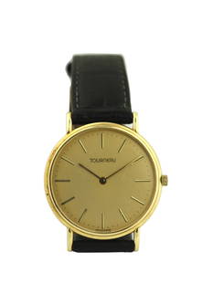 Tourneau 14K Yellow Gold Dress Watch: Tourneau 14K Yellow Gold Dress Watch Case Material: 14K Yellow Gold Case Diameter: 31mm Strap: Black leather with buckle closure gross weight 22.3 grams Movement: Quartz (battery-operated)