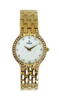 Concord 14K Yellow Gold Diamond Bezel Wristwatch: Concord 14K Yellow Gold Diamond Bezel Wristwatch Total Weight: 53.5g Material: 14K Yellow Gold Bracelet Length: 5 1/2 inches Features: Diamond bezel, mother-of-pearl dial catalogue note: A refined