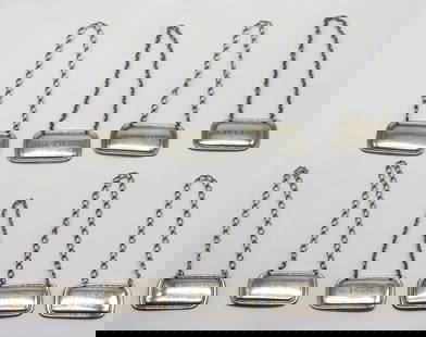 Set of Eight Tiffany & Co. Sterling Silver Decanter Labels: Set of Eight Tiffany & Co. Sterling Silver Decanter LabelsAmerican, circa 1930A refined and elegant set of eight sterling silver decanter labels by Tiffany & Co., each finely crafted in a classic