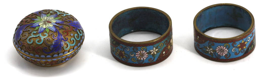 Chinese Cloisonne Enamel Covered Box and Two Fabric Rings: Chinese Cloisonne Enamel Covered Box and Two Fabric Rings Each circular and decorated with foliage. (3 pieces) Diameter of box 2.25 in.