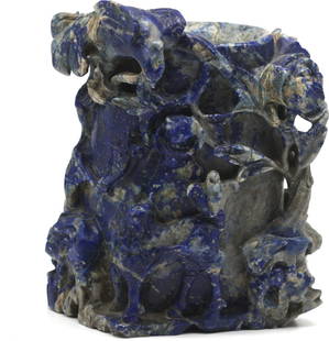 Chinese Carved Sodalite Vase: Chinese Carved Sodalite Vase The vessel carved in high relief with a mythical bird and beast amidst foliage with smaller birds on branches. Height 5.5 in., Width 5 in., Depth 3 in.