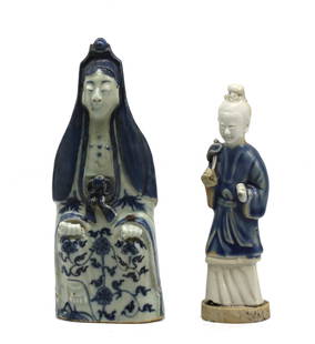 Two Chinese Blue and White Porcelain Figures: Two Chinese Blue and White Porcelain Figures Late 19th/early 20th Century. Comprising a seat pristess clothed in long robes,and a female figure. (the first repaired) Height 8 in., 6.5 in.