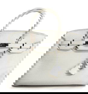 Hermès White Kelly Retourne 32cm Bag, 1998: Hermès White Kelly Retourne 32cm Bag, 1998 An elegant and timeless Hermès Kelly bag in classic white leather, measuring approximately 32cm (12.5 inches) in width. Crafted in Retourne style, this