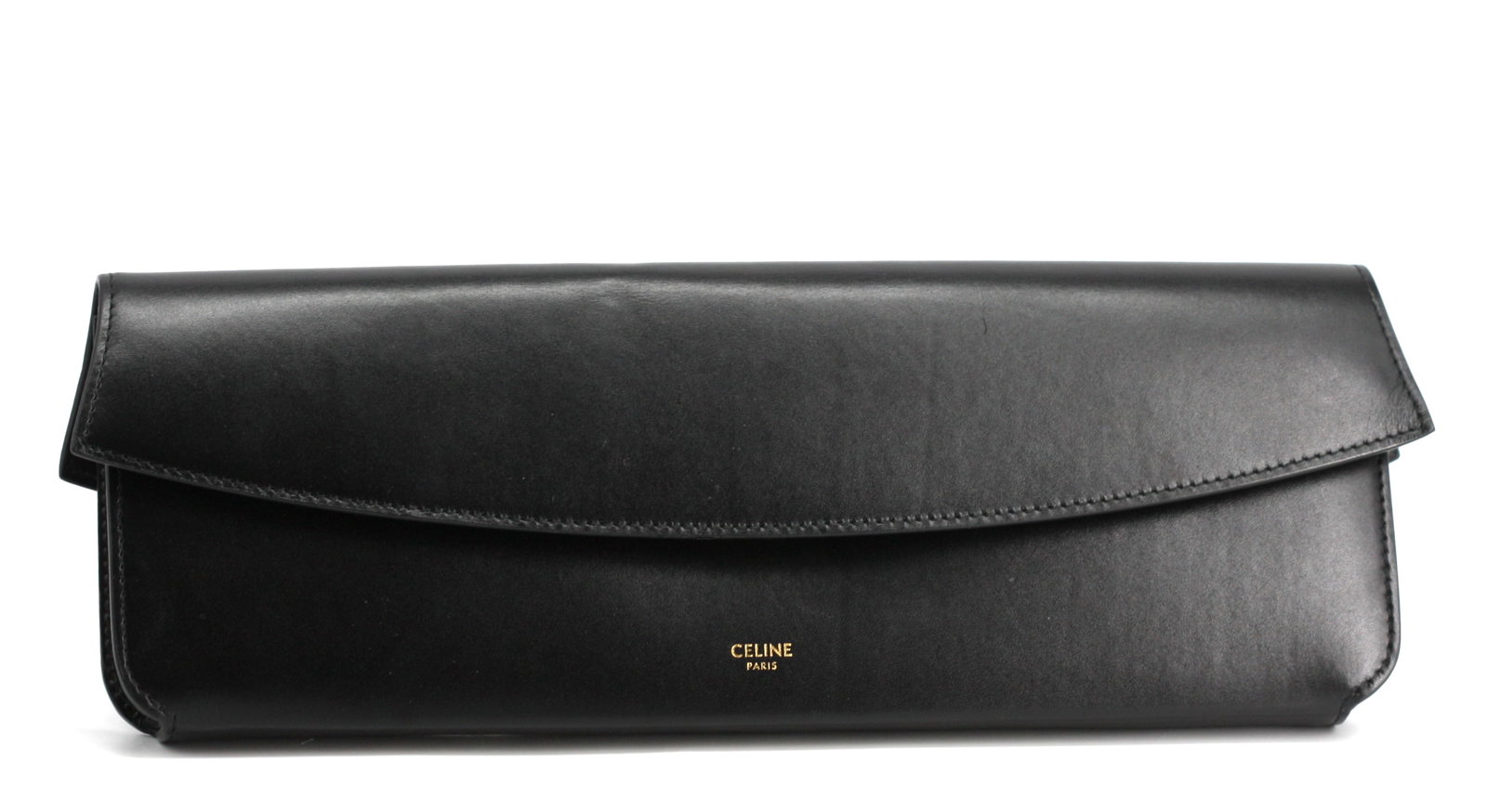 Celine Black Leather Clutch: Celine Black Leather Clutch Rectangular, the shaped flap with snap closure, the black leather-lined interior with an large open pocket. Height 4.5 in., Width 13.5 in., Depth 1.25 in.