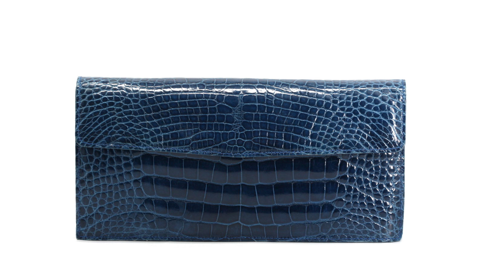 Laurent Effel Blue Crocodile Clutch: Laurent Effel Blue Crocodile Clutch Rectangular, with a snap closure, the black leather-lined interiorwith a zipper pocket, lacks shoulder strap. Height 5 in., Width 10 in., Depth 1.5 in.