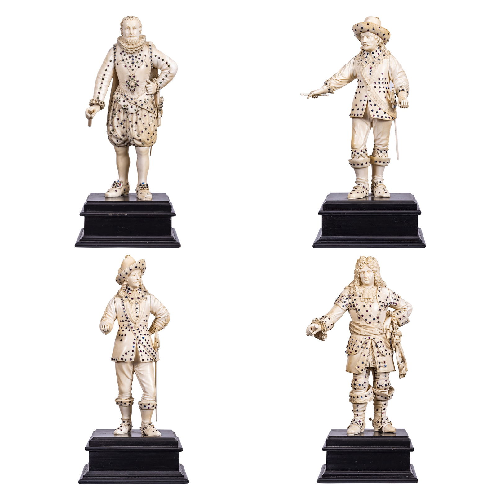 A Set of Four Sapphire and Ruby Inlaid Carved Court Figures: A Set of Four Gem-Inlaid Carved Court Figures Continental, probably French or German, late 19th century Extensively inlaid with sapphires and rubies, confirmed by testing, each finely carved figure is