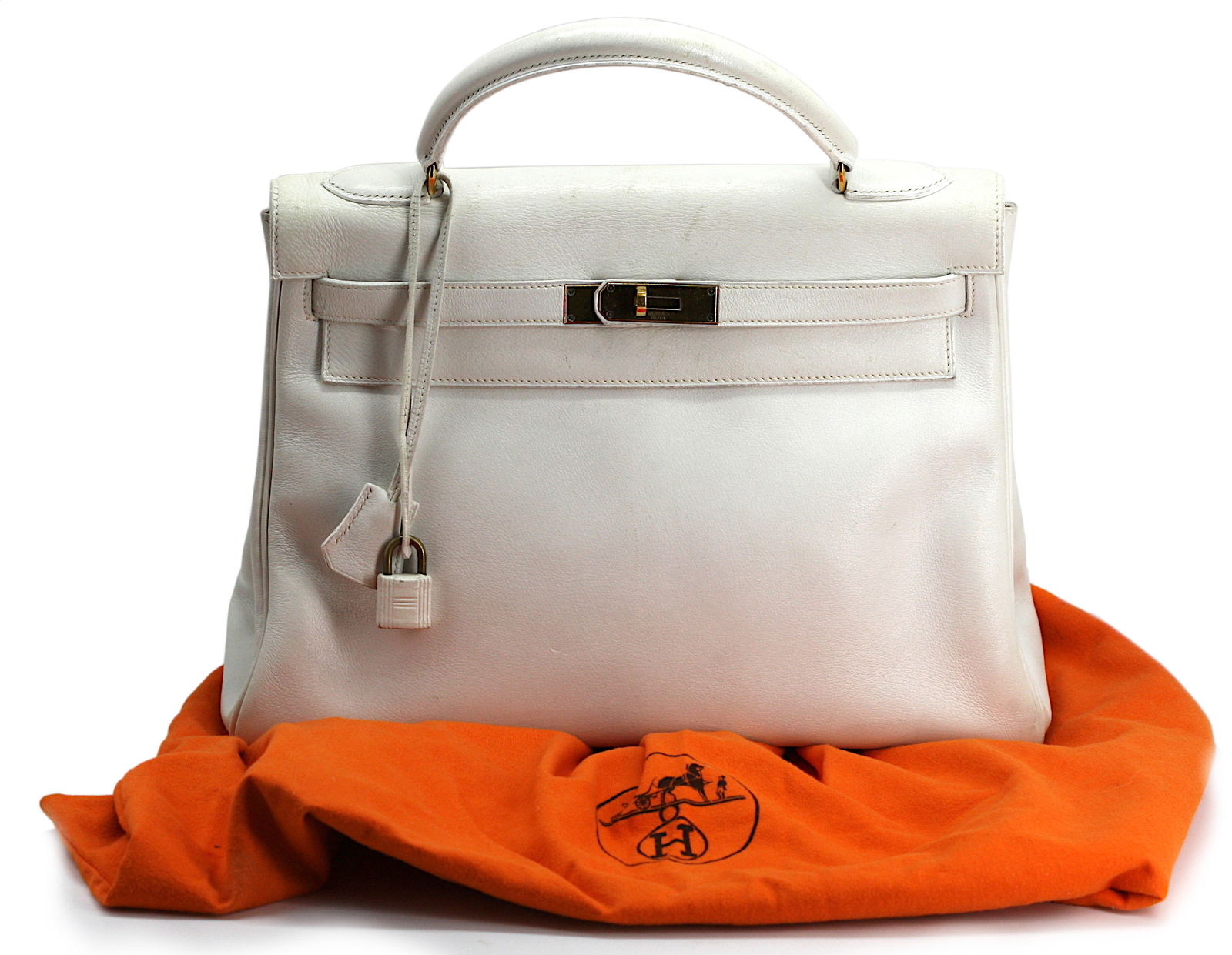 Hermès 32 cm White Kelly Retourne Bag (1972 & bull; Circle?B),: Hermès 32 cm White Kelly Retourne Bag (1972 • Circle?B), Retailed by Bonwit Teller, Gold HardwareA timeless classic from Hermès, this 12? wide (32?cm) Kelly Retourne is expertly crafted in