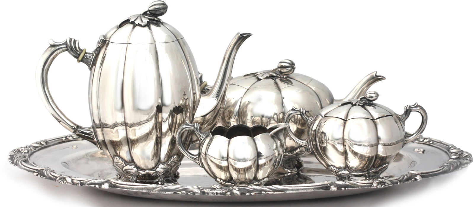 Continental Four-Piece Silver Tea and Coffee Service with Silver-Plated Tray: Continental Four-Piece Silver Tea and Coffee Service with Silver-Plated Tray Early to Mid-20th Century. A refined Continental four-piece silver tea and coffee service of melon form, each vessel with l
