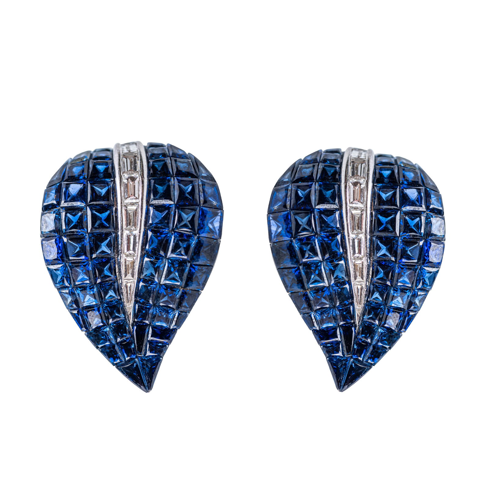 Sabadini, Pair of 18 Karat White Gold, Sapphire and Diamond Ear Clips: Pair of 18 Karat White Gold, Sapphire and Diamond Ear Clips, Sabadini Each of stylized leaf form, invisibly set with calibré-cut sapphires of deep, vibrant blue, accented by a central row of channel-