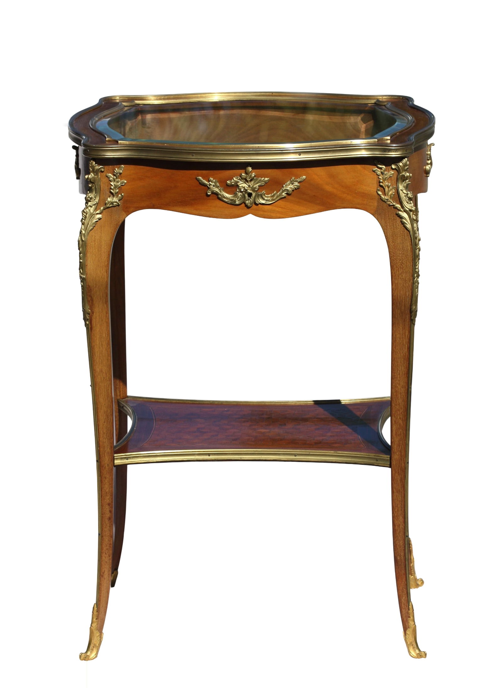Louis XV Style Gilt Bronze Mounted Mahogany Small Vitrine Table: Louis XV Style Gilt Bronze Mounted Walnut Small Vitrine Table Bearing a F. Linke signature. The beveled glass top set in a bronze border, hinged to open to a well, the serpentine shaped frieze with fo