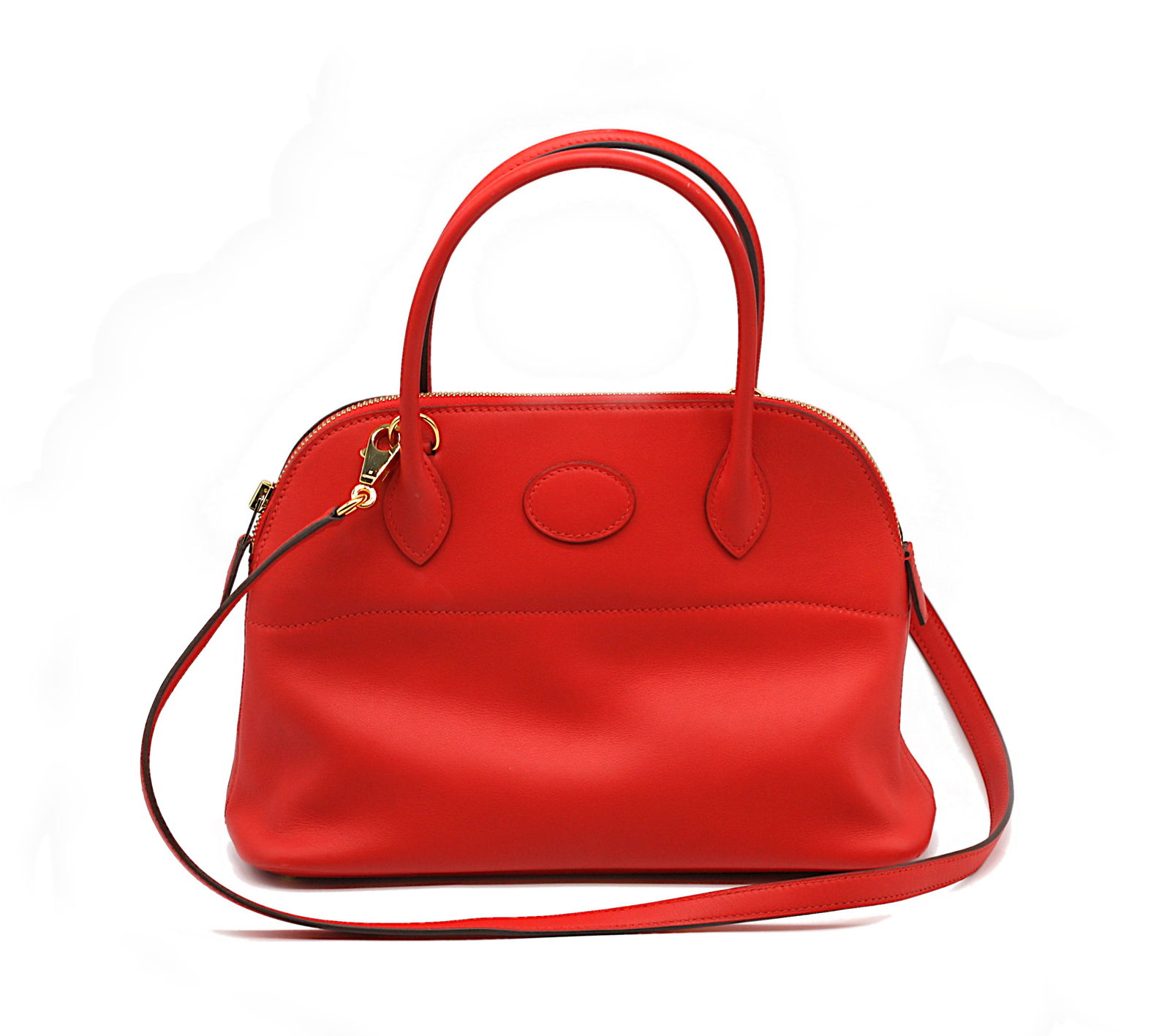 Hermes Red Swift Leather Bolide 27: Hermes Red Swift Leather Bolide 27 Double-rolled loop handles, gold-toned hardware, red leather shoulder strap, with red leather-lined interior with a slit pocket. Height, including handles 12 in.,