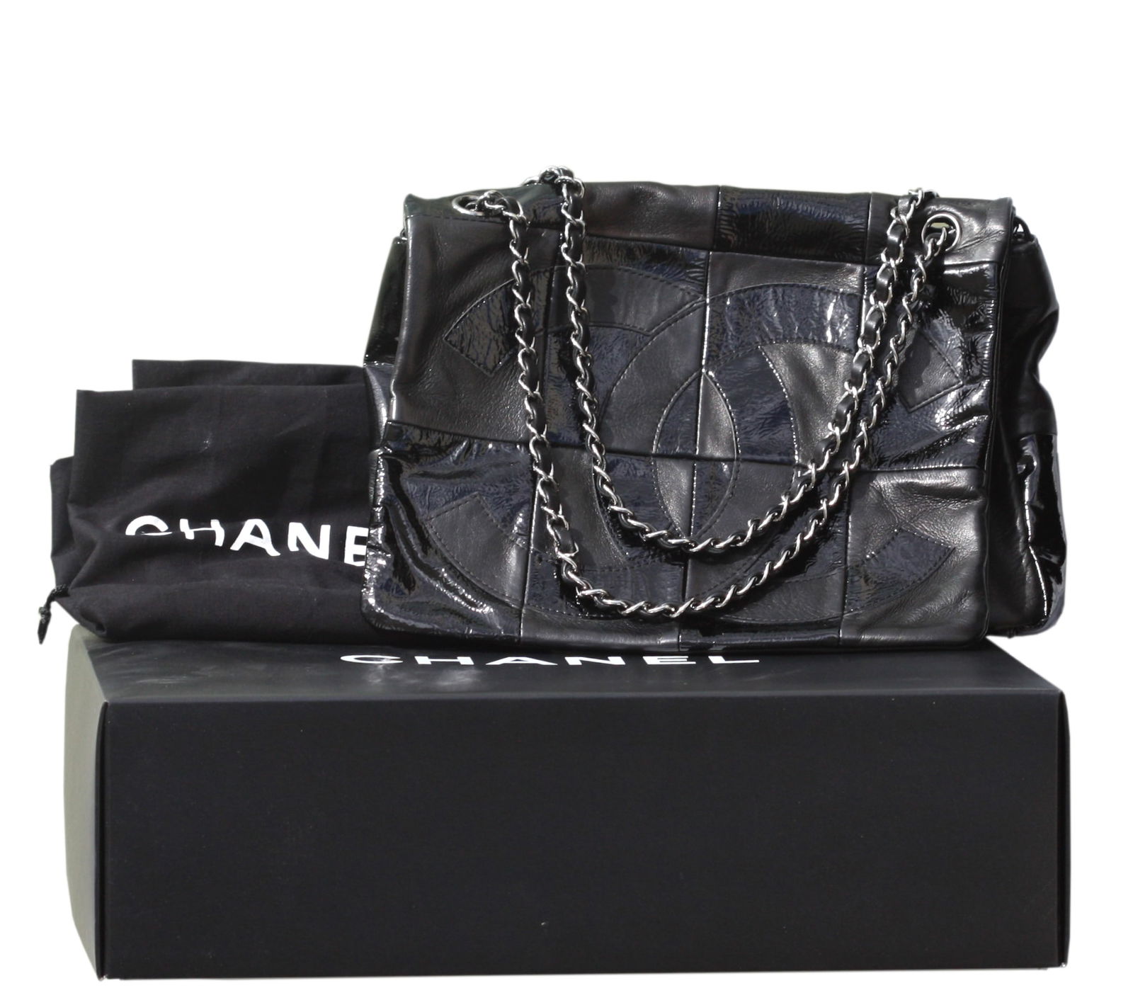 Chanel Black Leather Patchwork Flap Bag with Chain Strap: Chanel Black Leather Patchwork Flap Bag with Chain Strap Black leather patchwork exterior with CC motifSilver-tone leather-woven chain shoulder strapsFabric-lined interior with Chanel label Width: app