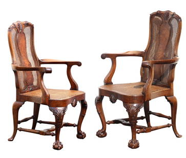 Pair of George I Style Parcel Caned Walnut Armchairs: Pair of George I Style Parcel Caned Walnut Armchairs Early 20th Century. The shaped caned backs with solid splats and shell-carved crest rail, raised on conforming cabriole legs united by a H-Form str