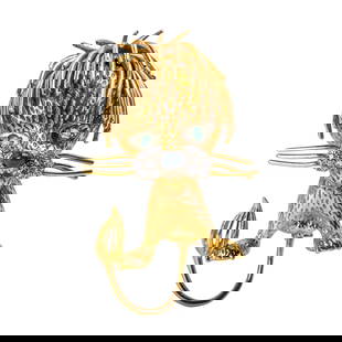 14K Gold, Diamond, Emerald, and Onyx Lion Brooch: 14K Gold, Diamond, Emerald, and Onyx Lion Brooch Of playful design, the sculpted lion formed in finely textured 14K yellow gold, with emerald eyes, diamond-set muzzle, and cabochon onyx nose.