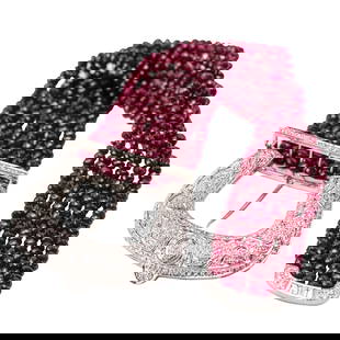 18 Karat White Gold, Ruby and Diamond Bracelet: 18 Karat White Gold, Ruby and Diamond Bracelet Designed as a belt motif, composed of seven rows of faceted ruby beads displaying a vivid purplish-red hue, completed by a buckle-form clasp pavé-set