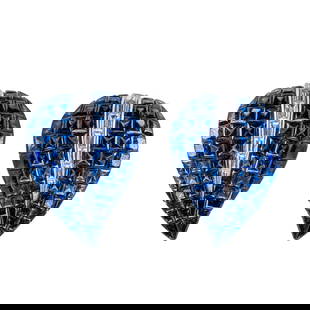 Sabbadini, Pair of 18 Karat White Gold, Sapphire and Diamond Ear Clips: Pair of 18 Karat White Gold, Sapphire and Diamond Ear Clips, Sabbadini Each of stylized leaf form, invisibly set with calibré-cut sapphires of deep, vibrant blue, accented by a central row of