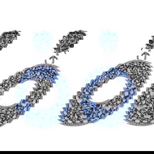 Pair of Sapphire and Diamond Earrings, 18K White Gold: Pair of Sapphire and Diamond Earrings, 18K White Gold Each designed as a bold open oval plaque, pavé-set with a mosaic of approximately ninety-two oval and round-cut blue sapphires, framed by a