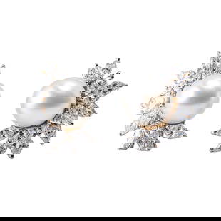 Pair of Platinum, South Sea Pearl, and Diamond Ear Clips: Pair of Platinum, South Sea Pearl, and Diamond Ear Clips Each centering a lustrous white South Sea cultured pearl measuring approximately 13 mm, accented by clusters of marquise-cut and round