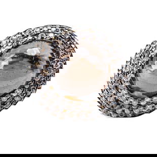 18 Karat White Gold, Black Quartz, and Diamond Ring: 18 Karat White Gold, Black Quartz, and Diamond Ring Centering a high-domed cabochon black quartz measuring approximately 15 × 11 mm, weighing approximately 20 carats, framed and set along the