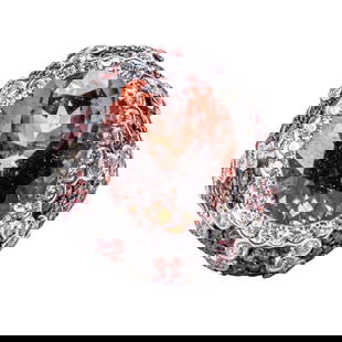 18K White Gold, Pink Tourmaline, Garnet, and Diamond Ring: 18K White Gold, Pink Tourmaline, Garnet, and Diamond Ring An impressive 18K white gold dome ring centering an oval-cut pink tourmaline of exceptional depth and brilliance, weighing approximately