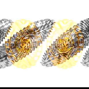 Pair of French 18 Karat Gold, Yellow Sapphire, and Diamond Ear Clips: Pair of French 18 Karat Gold, Yellow Sapphire, and Diamond Ear Clips French, circa 1980s, with French hallmarks. Each designed as a sculptural oval form centering an oval-cut yellow sapphire