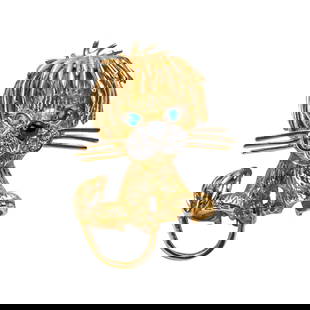 18K Gold, Diamond, Emerald, and Onyx Lion Brooch: 18K Gold, Diamond, Emerald, and Onyx Lion Brooch Charming sculpted lion brooch crafted in finely textured 18K yellow gold, accented with emerald eyes, a pavé diamond muzzle, and cabochon onyx nose.